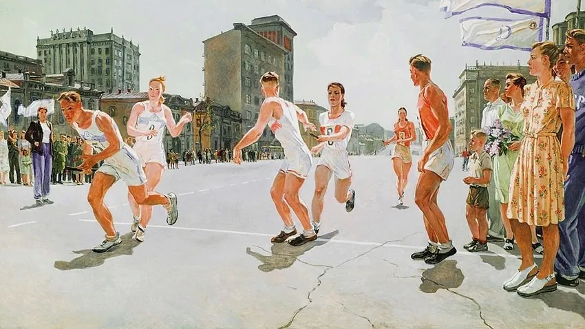 Runners in white uniforms race down a city street past spectators.